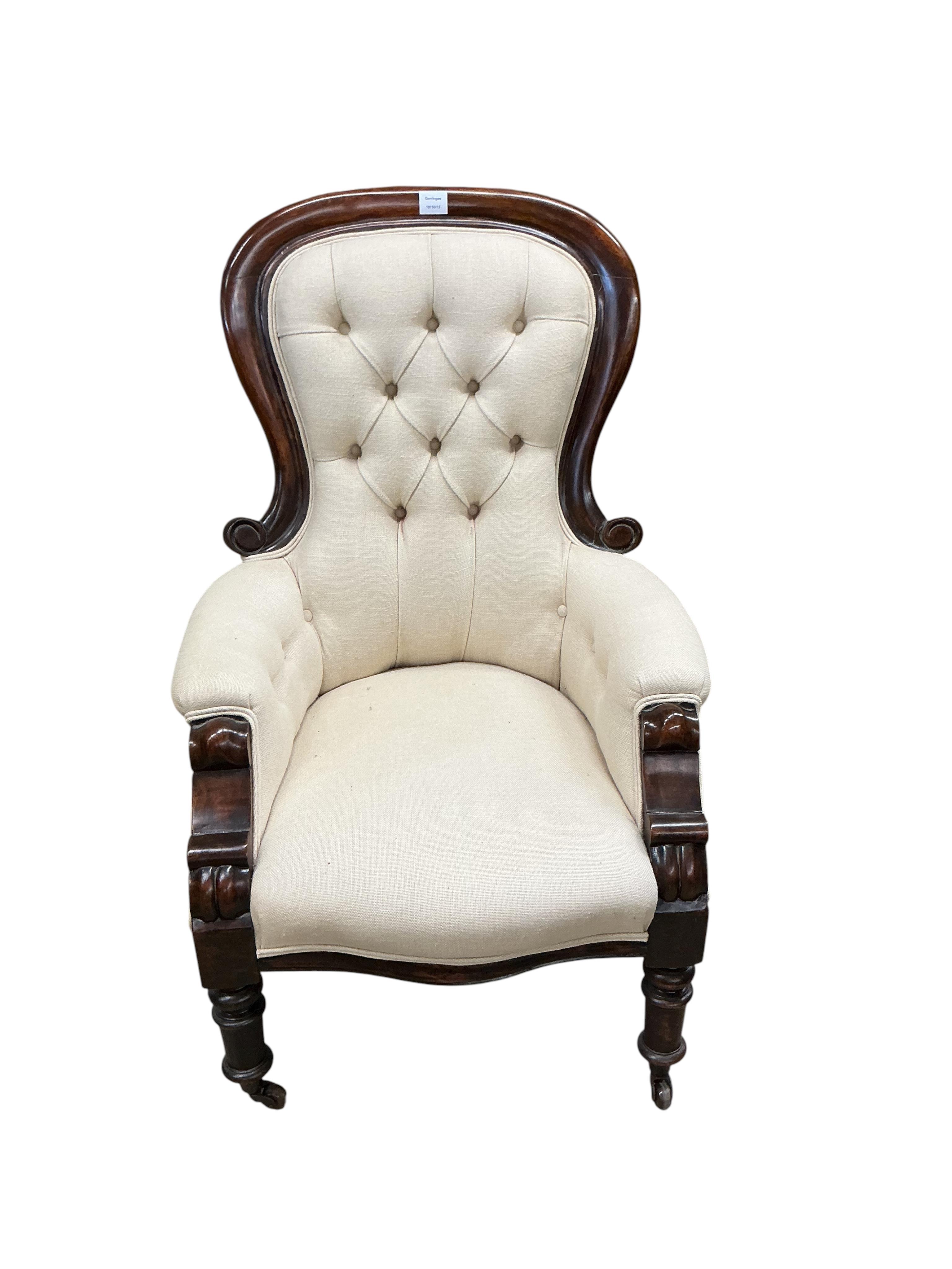 A Victorian mahogany upholstered spoonback armchair, width 70cm, depth 66cm, height 104cm